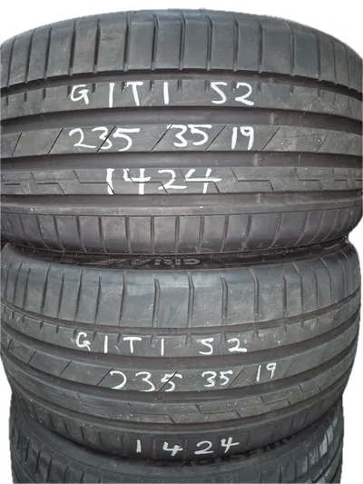 Stacked Giti tyres with chalk writing